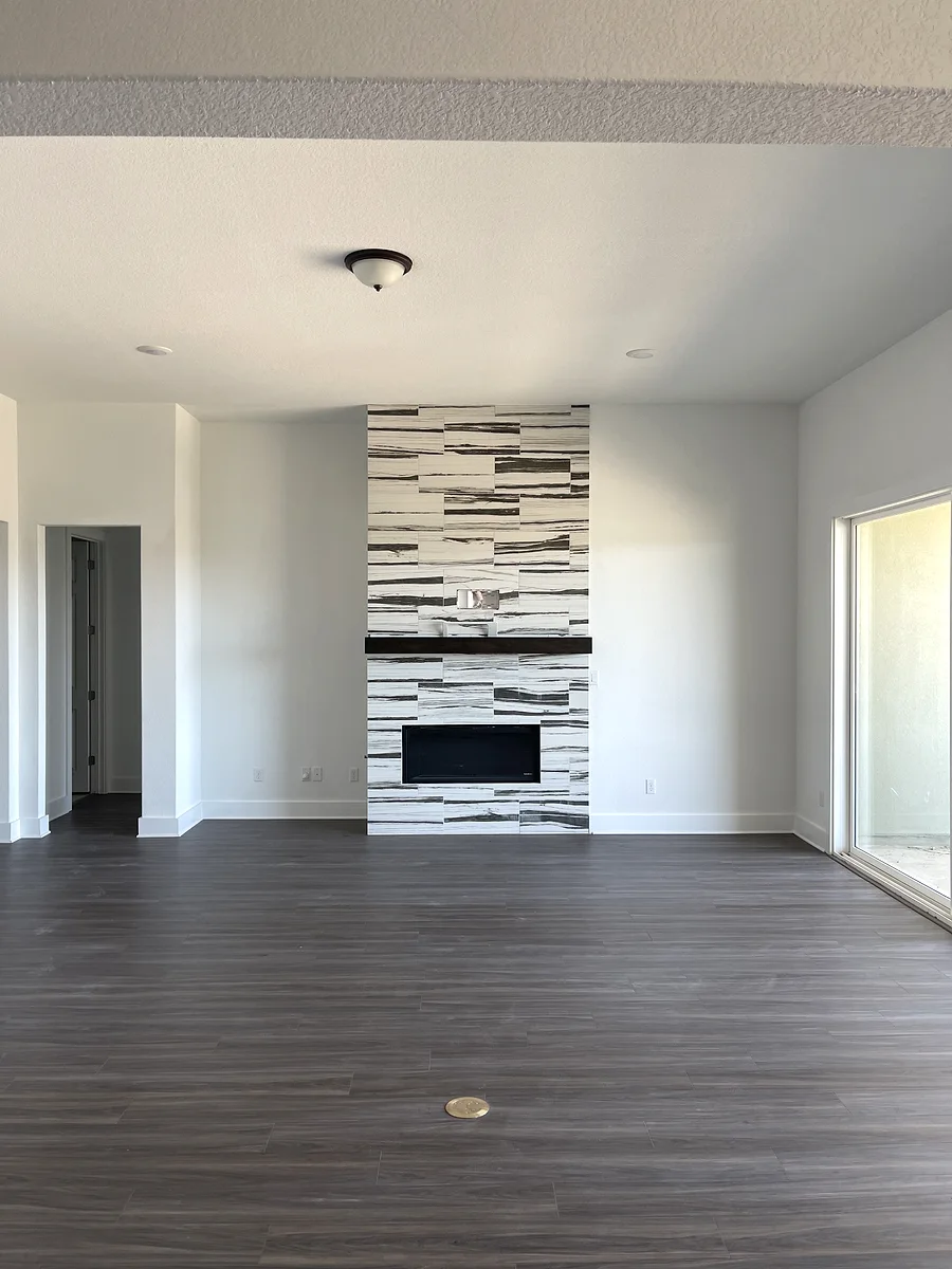 Bee Cave interior painting project with bright open walls and a fireplace wall tile feature