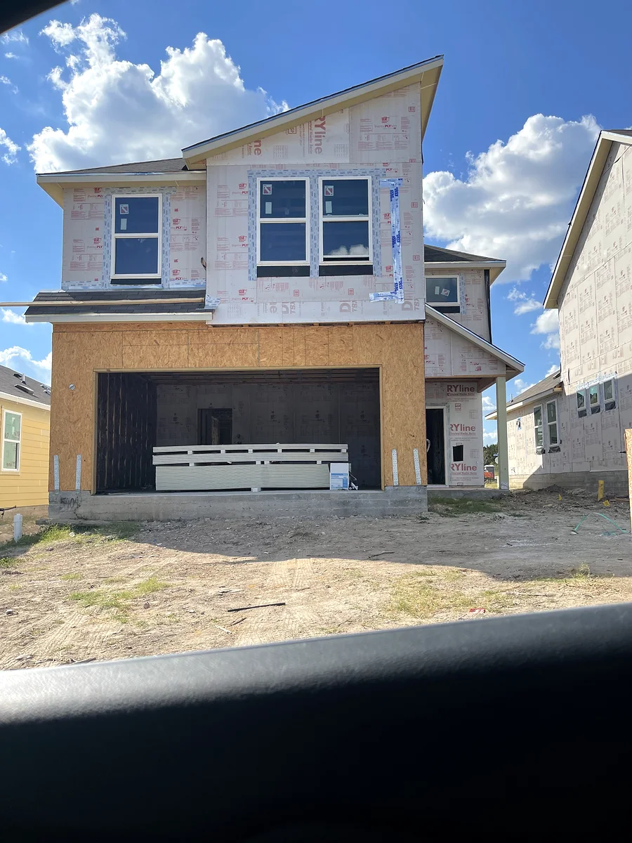 Pflugerville house exterior during an earlier project stage before final siding and trim painting